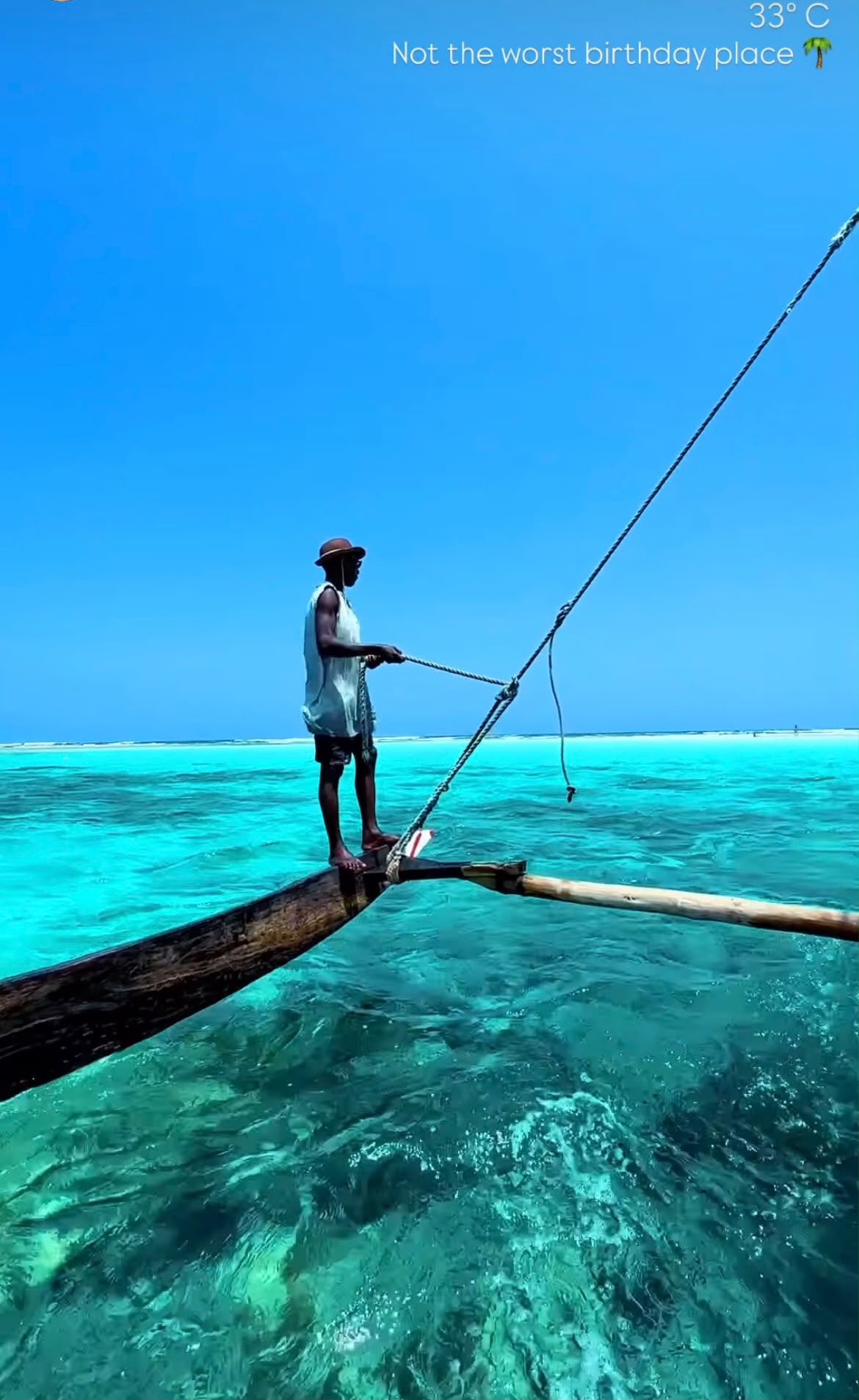 Boat on turquoise water in Diani